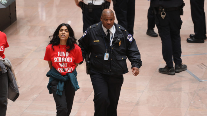 Activists arrested while protesting US military support for Israel. [Photo by Kristine Jones, courtesy of Adalah Justice Project]