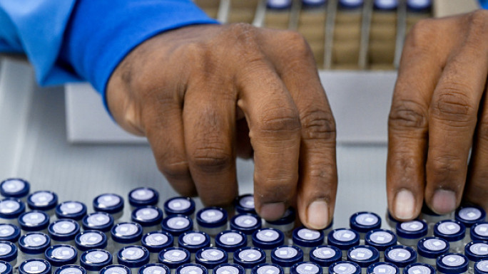 n this photograph taken on February 27, 2024, a staff packs vials of the R21 Malaria Vaccine at the Serum Institute of India (SII) headquarters in Hadapsar, Pune.