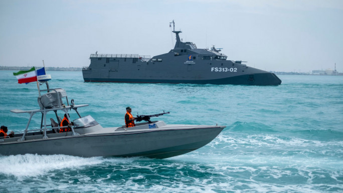 The IRGC Navy Martyr Hassan Bagheri warship and an IRGC speed boat are sailing along the Persian Gulf during the IRGC marine parade