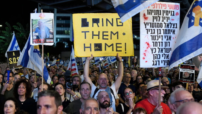 Thousands of Israelis protest against the Israeli government, calling for the immediate release of the hostages still held by Hamas in Gaza, outside the Ministry of Defence in Tel Aviv, Israel, on September 7, 2024. (Photo by Gili Yaari/NurPhoto via Getty Images)