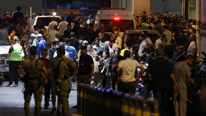 People gather at the entrance of the American University of Beirut Medical Center, on September 17, 2024, after pagers exploded in several Hezbollah strongholds around Lebanon (Photo by ANWAR AMRO / AFP)