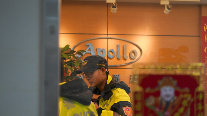 Police officers are seen at Taiwanese company Gold Apollo office in New Taipei, Taiwan, September 18, 2024. (Photo by Walid Berrazeg/Anadolu via Getty Images)