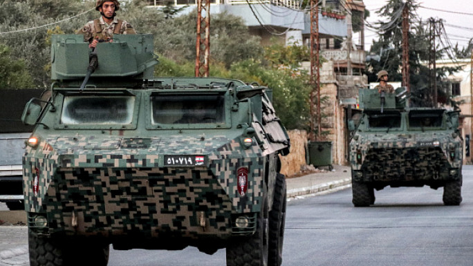 Lebanese Army vehicles patrol the town of Marjaayoun in southern Lebanon near the border with Israel on October 25, 2024. (AFP via Getty Images)