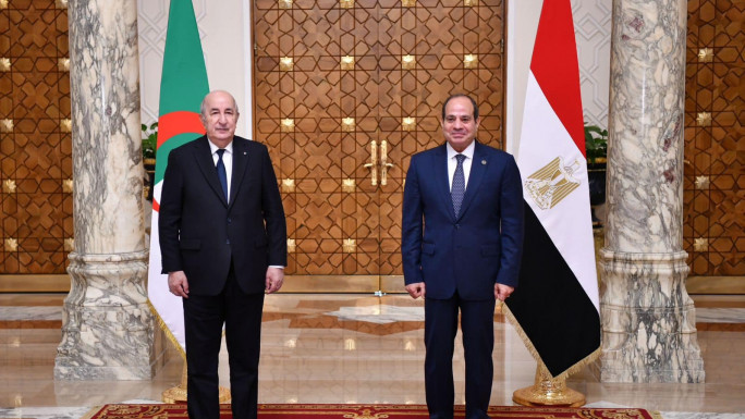 Algerian President Abdelmadjid Tebboune (L) is welcomed his Egyptian counterpart Abdel Fattah el-Sisi (R) 