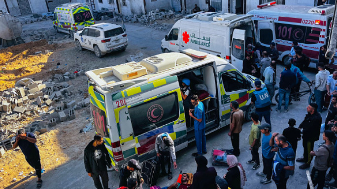 Medics evacuate injured people and cancer patients from the Kamal Adwan Hospital in Beit Lahia in the northern Gaza Strip on October 28, 2024, to al-Shifa hospital in Gaza City in a joint World Health Organisation and Palestinian Red Crescent initiative. 