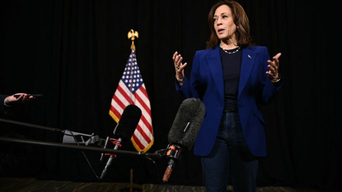 Democratic presidential nominee, US Vice President Kamala Harris speaks to members of the media before leaving her hotel in Madison, Wisconsin