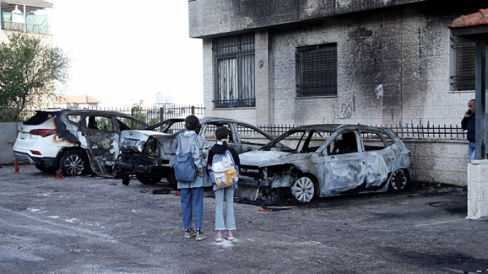 Aftermath of burned Palestinian vehicles in West Bank [Getty]