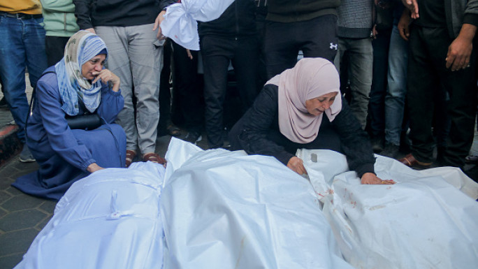 Palestinians mourn loved ones [Getty]