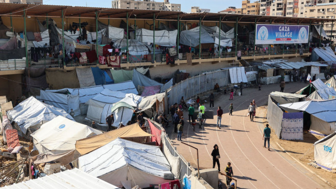 Tents sheltering displaced Palestinians are pictured at the Yarmouk Sports Stadium, once a football arena, in Gaza City on 19 November 2024