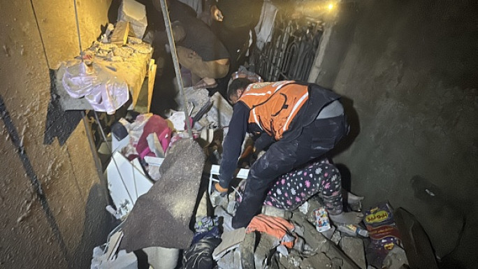 Civil defense teams and residents conduct search and rescue operation after Israeli attacks hit an house belonging to Aruki family on Sheikh Ridwan neighborhood in Gaza City, Gaza on November 20, 2024. 