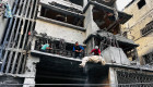 Palestinian first responders remove a body from the rubble of a building following an Israeli strike in Beit Lahia, in the northern Gaza Strip