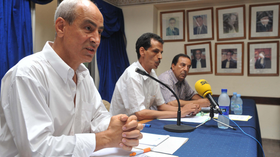 Members of the Parliamentary Monarchy Now in Morocco coalition, from left, Fouad abdelmoumni, Ali Ben Dine and Abdelamin Rayi give a press conference on June 28, 2011 in Rabat. (Photo credit should read ABDELHAK SENNA/AFP via Getty Images)