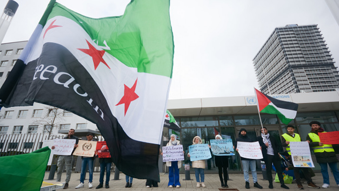 Dozens of protesters are gathering in front of the United Nations Square in Bonn, Germany, on March 4, 2023