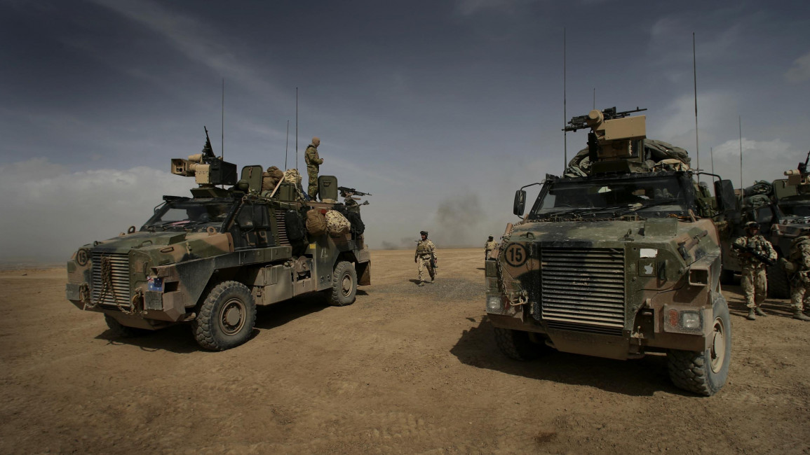 Australian soldiers arrive at Tarin Kowt after completing a patrol in the Baluchi Valley