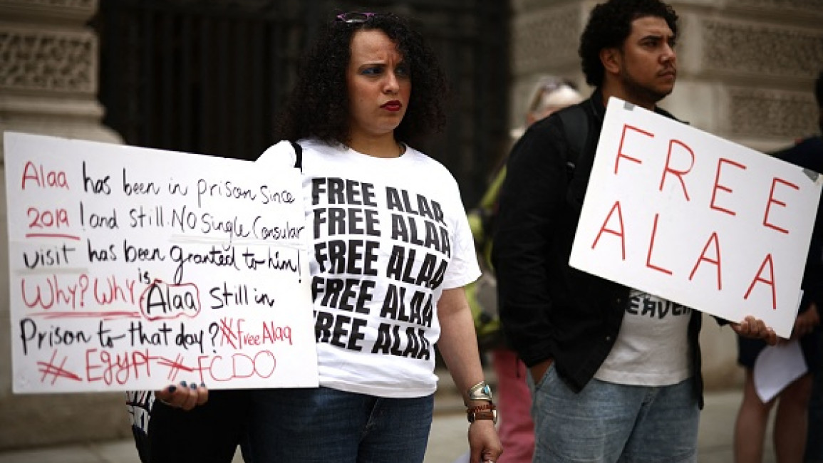 Protesters hold placards during a demonstration in support of jailed British-Egyptian activist Alaa Abdel Fattah outside the Foreign Office in London on July 3, 2023.