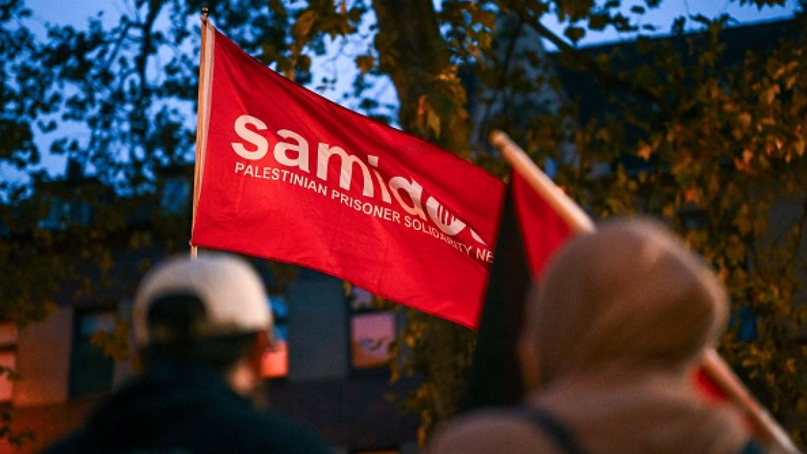 A photo shows a flag of the pro-Palestine organization 'Samidoun' during a "in solidarity with Gaza" demonstration in Duisburg, western Germany, on October 9, 2023. 