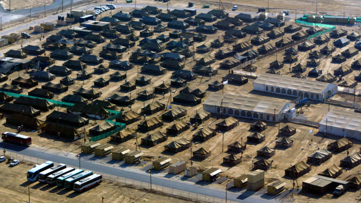 Aerial view of a military camp near kibbutz kissufim, built to participate in the Israeli pullout from Gaza Strip, 03 August 2005. AFP PHOTO/EITAN ABRAMOVICH (Photo by EITAN ABRAMOVICH / AFP) (Photo by EITAN ABRAMOVICH/AFP via Getty Images)	