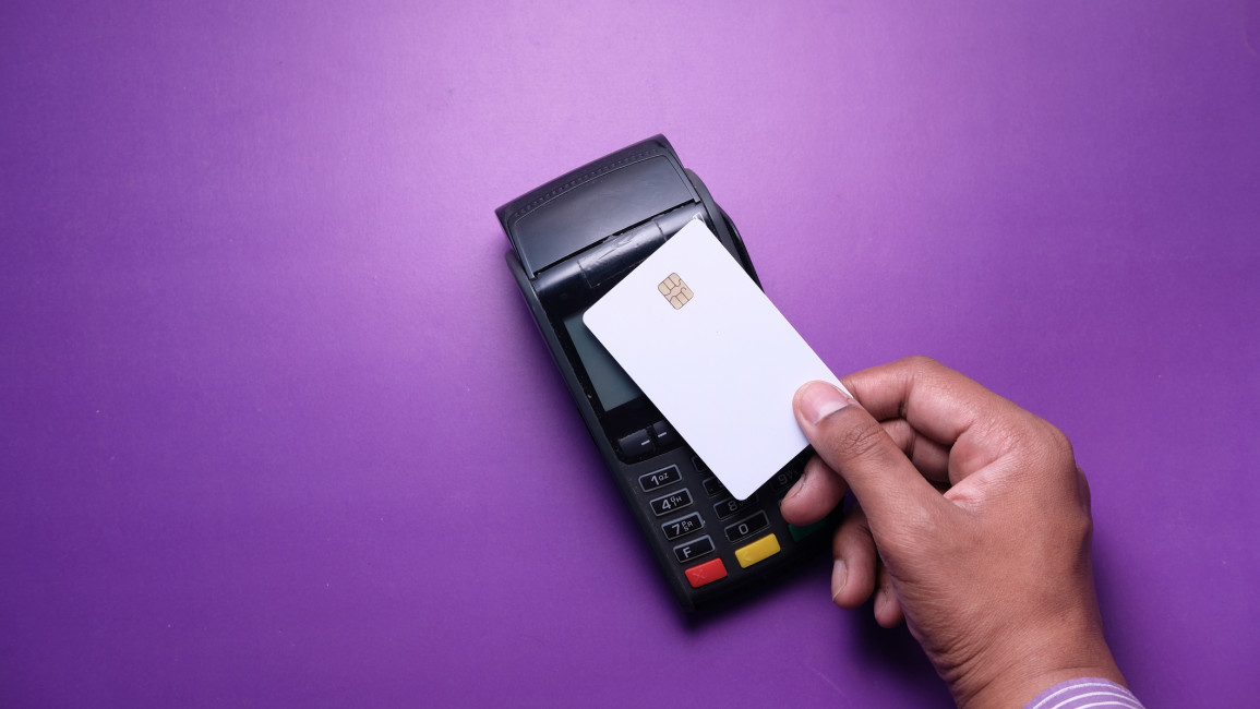 A person paying with a contactless card