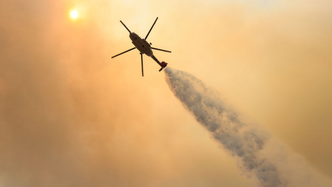 Helicopters battle the forest fire broke out in Marmaris district of Mugla
