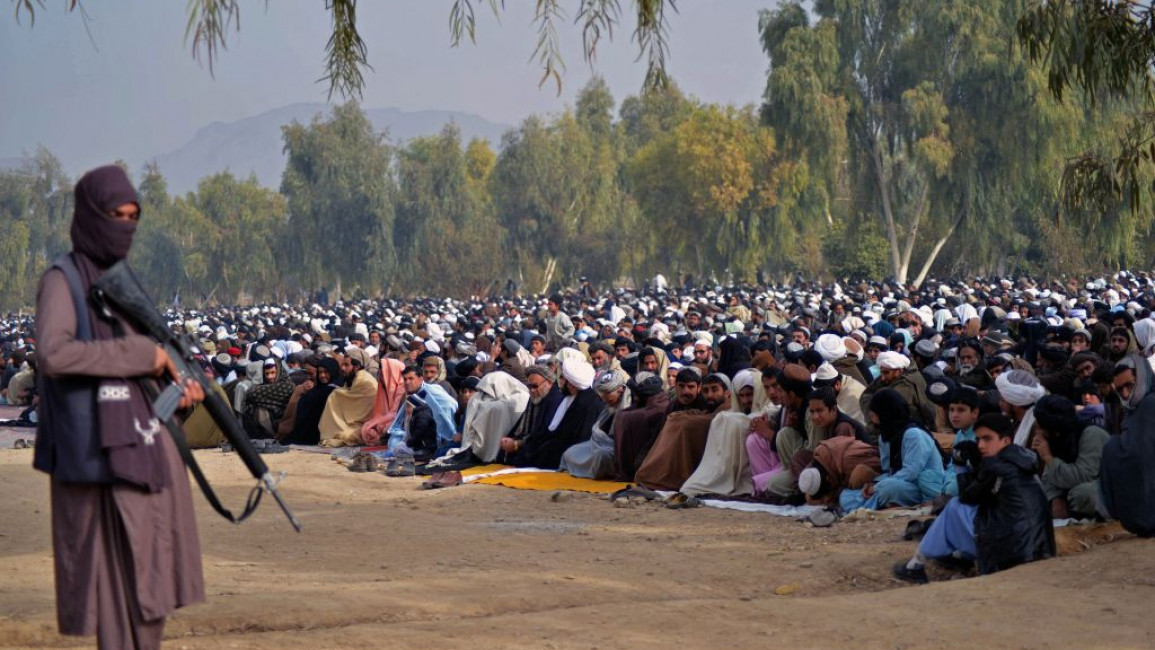 Taliban stand guard 