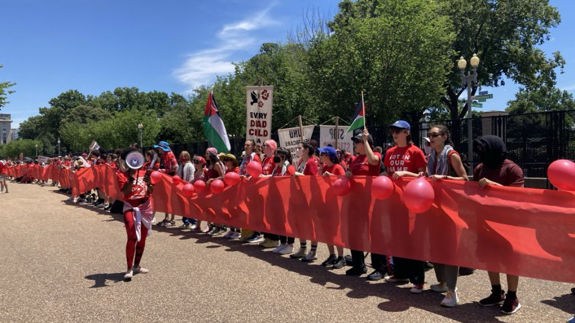 Pro-Palestinian demonstrators made a human "red line" surrounding the White House on Saturday. [Brooke Anderson/TNA]