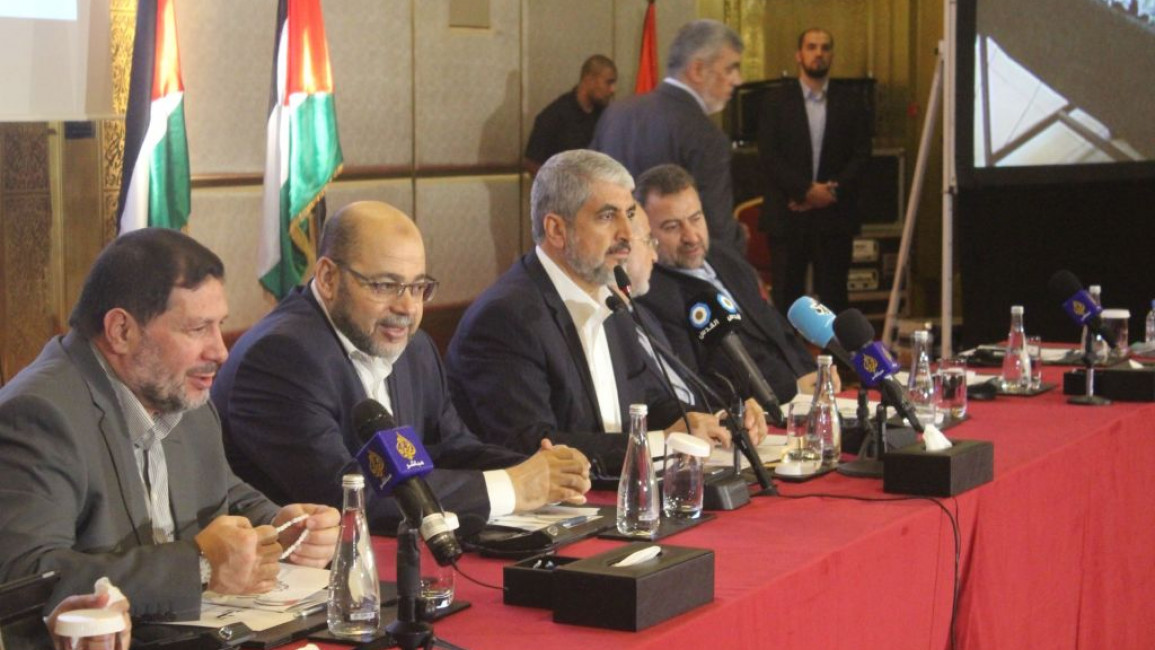 Khaled Meshaal (third from left) and Musa Abu Marzouk (second from left) have been named as potential successors to assassinated Hamas leader Ismail Haniyeh [Getty]