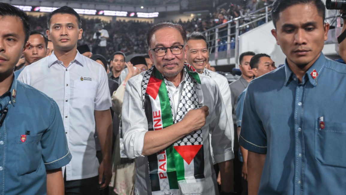 Anwar Ibrahim (centre) said that Malaysia would support the Palestinian people against Israel's genocide [Getty]