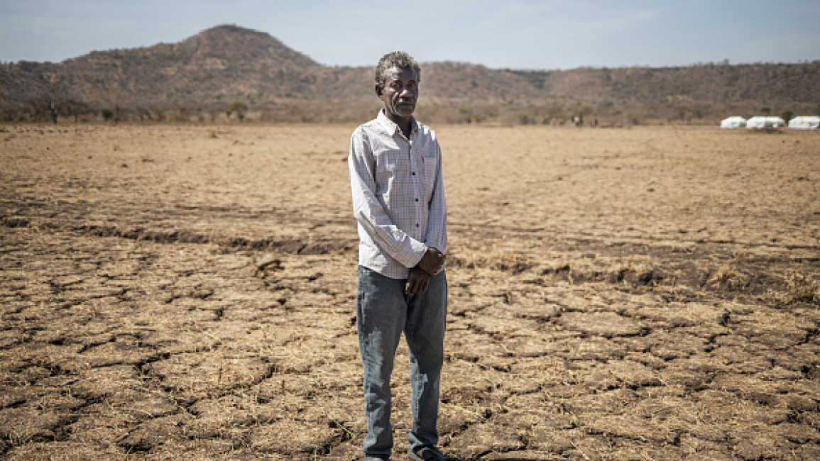 Alsadig Osman, 58, a refugee from Sudan, poses for a portrait on the outskirt of the newly established Awulala refugee camp, near Maganan, 80 km from the Sudanese border in Ethiopia's Amhara region, on February 28, 2024.