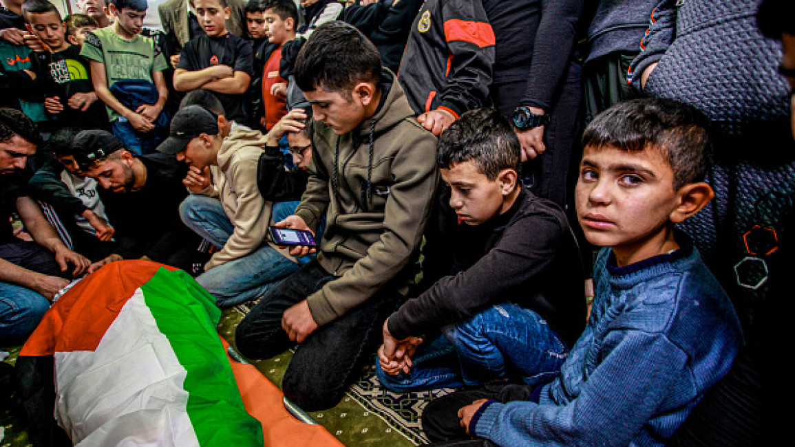 Palestinian children mourn loved one in West Bank [Getty]