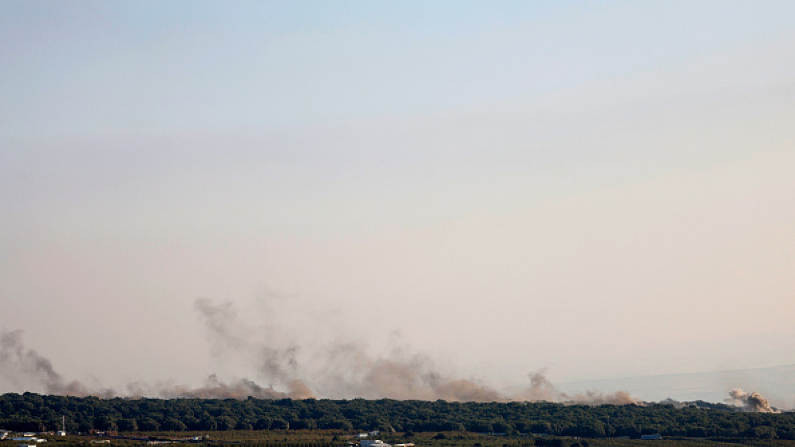 Smoke billows over hills in the Israeli-annexed Golan Heights after rockets were fired from southern Lebanon on August 6, 2024. A Lebanese security source said six Hezbollah fighters were killed in Israeli strikes on August 6.