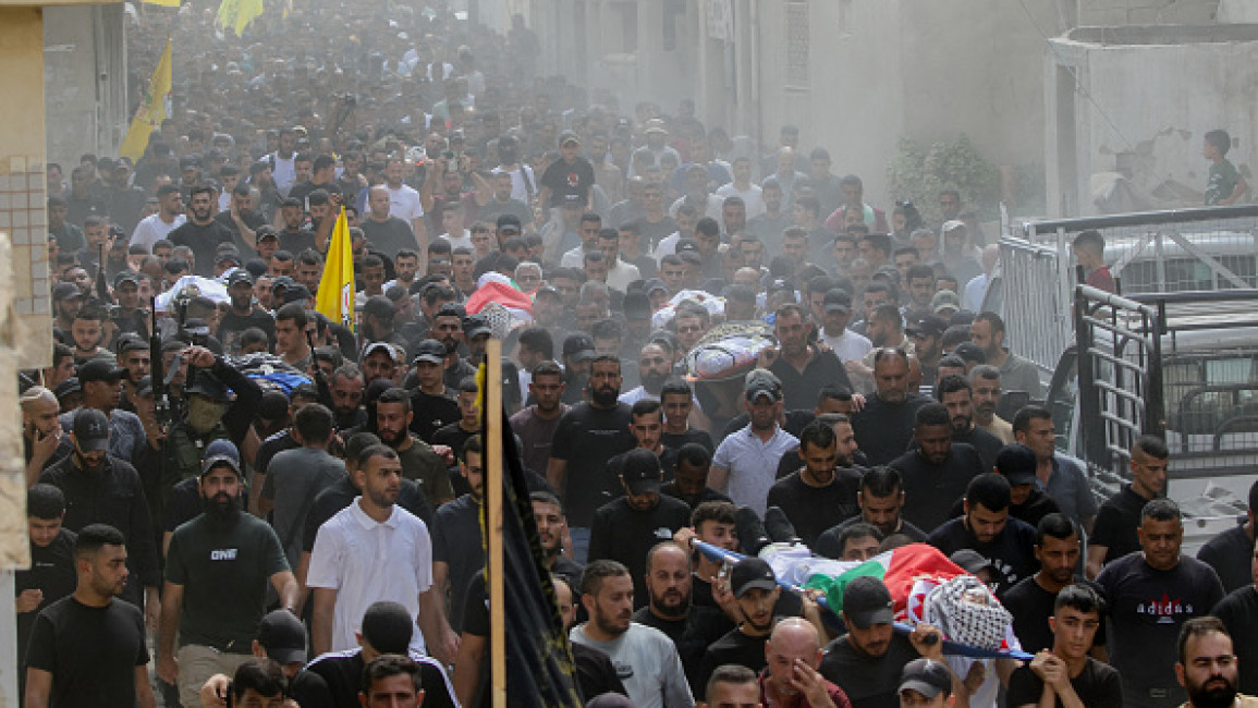 Mourners carry the bodies of Palestinians killed during an Israel raid in the northern part of occupied West Bank, during a group funeral procession in the Jenin refugee camp.