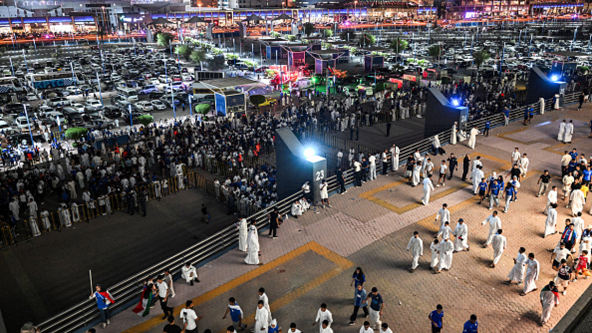 Spectators gather outside Jaber al-Ahmad International Stadium in Kuwait City on September 10, 2024 before the 2026 FIFA World Cup Asian qualification football match between Kuwait and Iraq. (Photo by Yasser AL ZAYYAT / AFP via Getty Images)