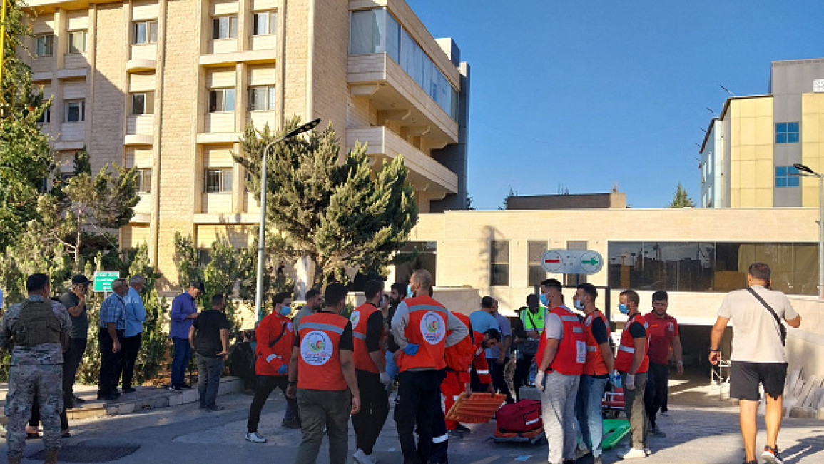 People gather outside a hospital in the city of Baalbeck in eastern Lebanon on September 17, 2024, after explosions hit locations in several Hezbollah strongholds around the country amid ongoing cross-border tensions