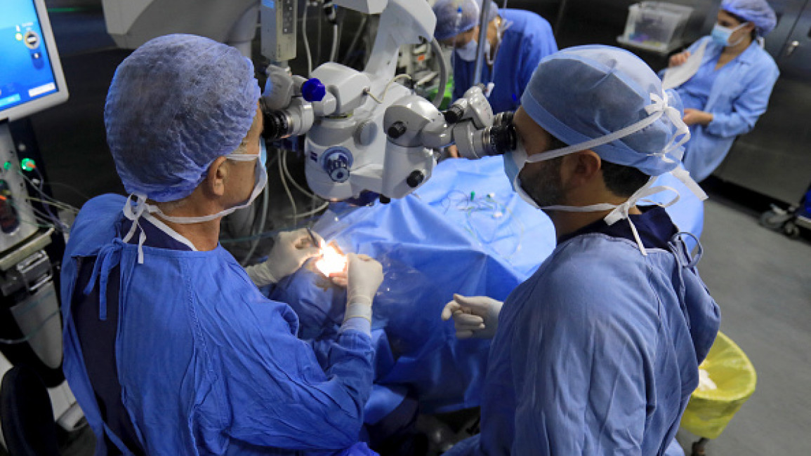 A doctor performs an eye surgery on a man who was injured on September 18, 2024, by the explosion of a communication device, at a hospital in Beirut on September 20, 2024.