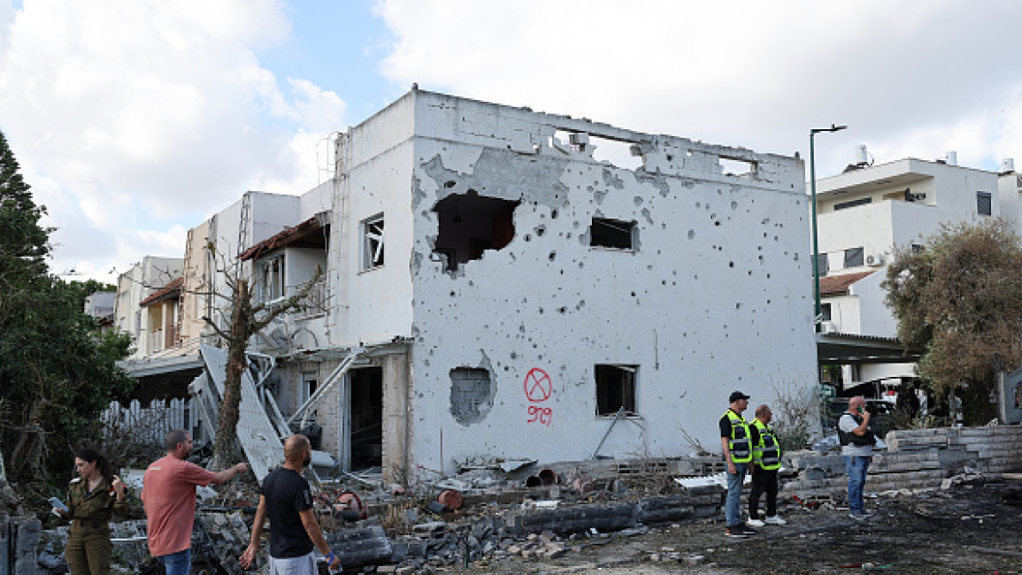 Residents check the damage in Kiryat Bialik in the Haifa district of Israel, following a reported strike by Lebanon's Hezbollah on September 22, 2024. (Photo by JACK GUEZ/AFP via Getty Images)