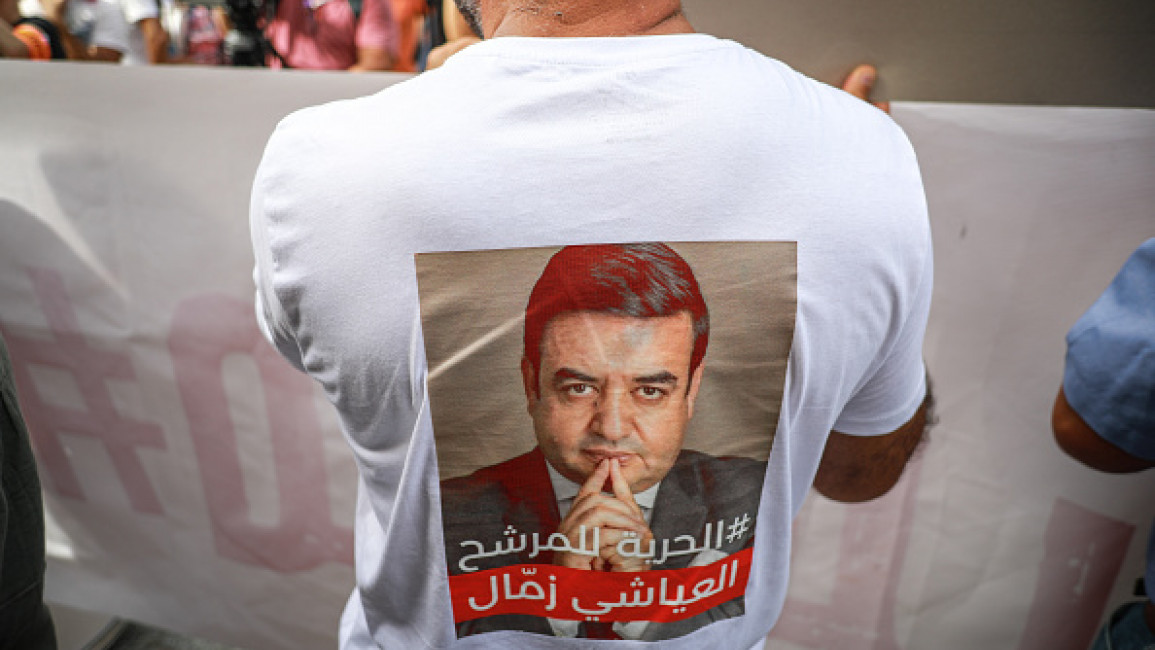 A demonstrator wearing a T-shirt with a photo of jailed presidential candidate Ayachi Zammel attends a demonstration on September 22, 2024, in Tunis, Tunisia. (Photo by Chedly Ben Ibrahim/NurPhoto via Getty Images)