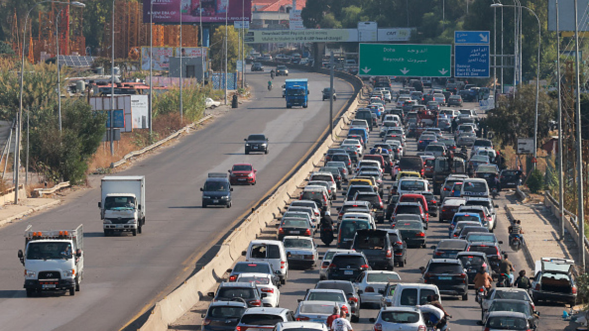 Vehicles wait in traffic in the town of Damour, south of the capital Beirut on September 24, 2024, as people flee southern Lebanon. (Photo by IBRAHIM AMRO/AFP via Getty Images)