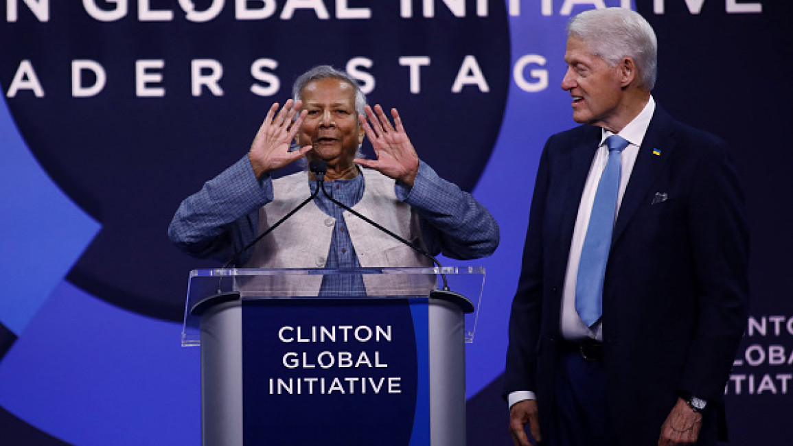 Bangladesh's interim leader Muhammad Yunus speaks next to former US President Bill Clinton (R) during the Clinton Global Initiative annual meeting in New York City on September 24, 2024. 