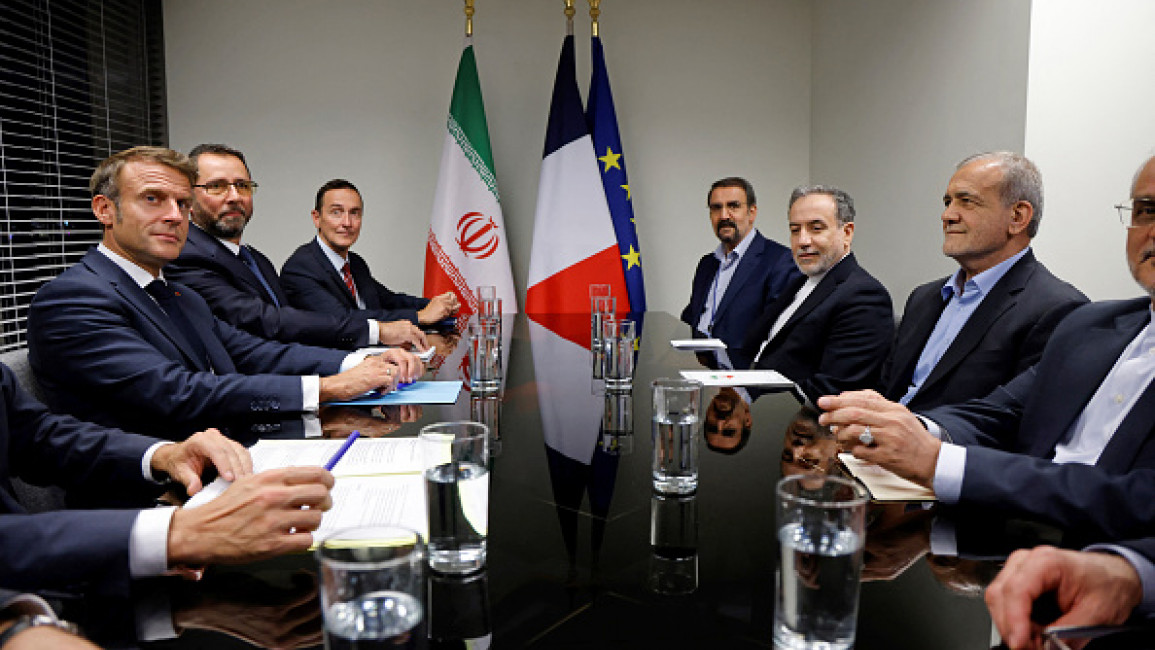 French President Emmanuel Macron (L) meets with Iran's President Masoud Pezeshkian (R) on the sidelines of the 79th Session of the United Nations General Assembly at the United Nations headquarters in New York City on September 24, 2024. 