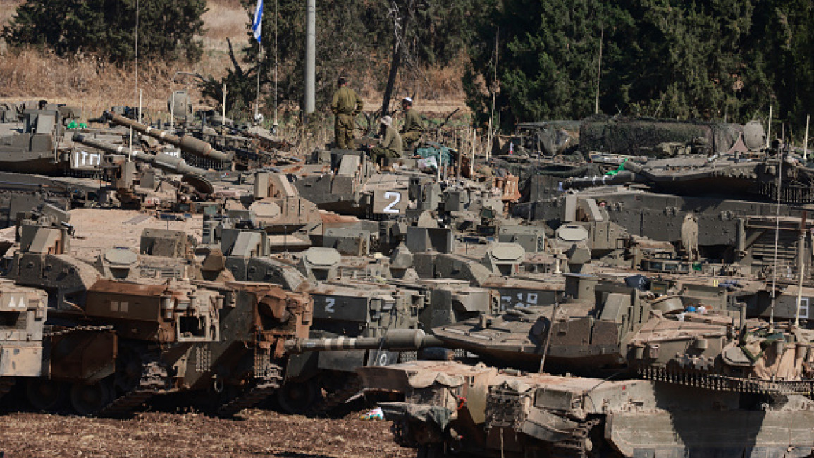 	Israeli army tanks are deployed in the Upper Galilee region of northern Israel near the border with Lebanon on September 29, 2024. 