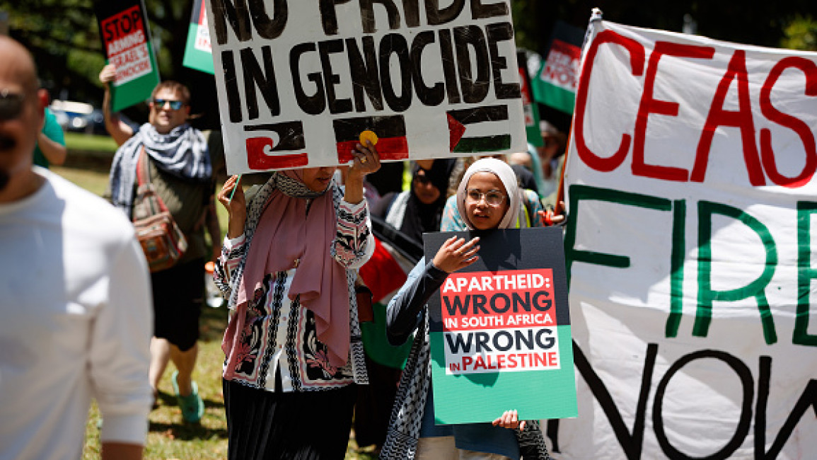 Demonstrators march through Cairns during a rally in solidarity with Palestine. Demonstrators gathered at the Cairns Esplanade to protest as part of a National Day of Action in support of Palestine, calling for a total ceasefire and for the Australian Government to sanction Israel. 