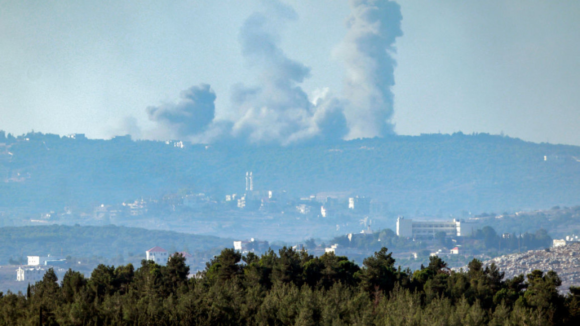 Israeli airstrikes seen striking Lebanon from afar.