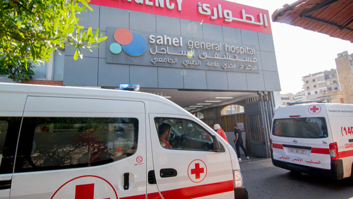 Ambulances and paramedics carry people wounded in Israeli bombing of Beirut's southern suburbs to the Sahel General Hospital on September 28, 2024. (Photo by FADEL ITANI/Middle East Images/AFP via Getty Images)