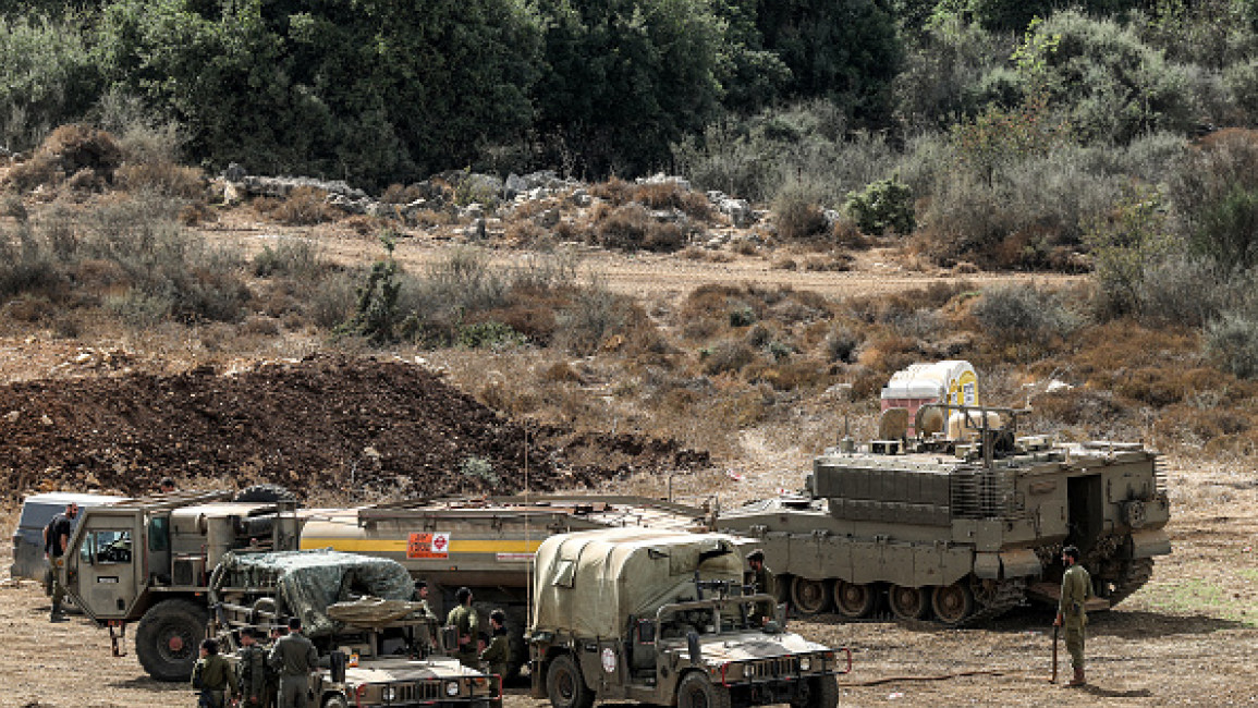 Israeli army vehicles deploy at a position along the border with Lebanon in northern Israel on October 1, 2024. The Israeli army on October 1 said it launched a ground offensive in Lebanon and that its forces engaged in clashes, further escalating the conflict after a week of intense air strikes that killed hundreds. The UN peacekeeping mission in Lebanon said, however, the Israeli operation did not amount to a "ground incursion" and while Hezbollah denied any troops had crossed the border, an Israeli secur