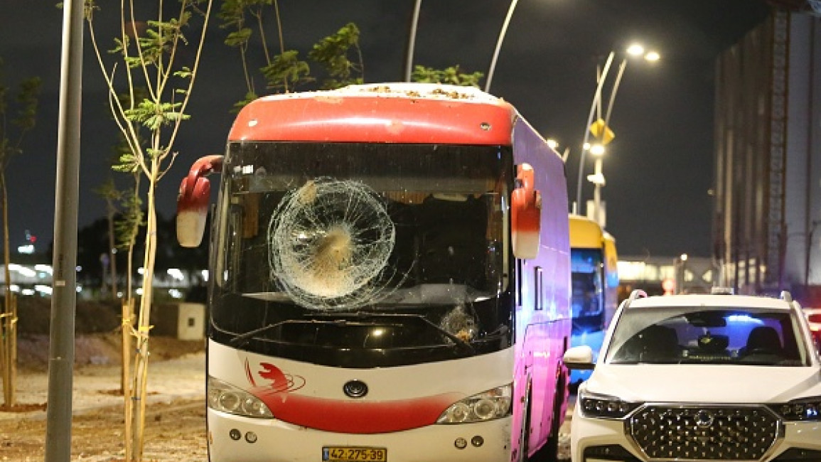  view of damaged vehicles as Israeli forces arrive in the area and investigate debris of missiles fired from Iran towards Israel, after they fall in Herzliya, north of Tel Aviv, Israel on October 01, 2024. The Israeli military reported that missiles were launched from Iran towards Israel, triggering sirens throughout the country, particularly in Tel Aviv.