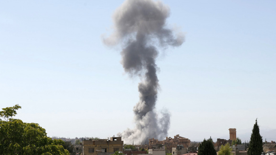 Smoke billows following an Israeli airstrike near the ruins of the ancient Roman Temple of Bacchus in Lebanon's eastern city of Baalbek in the Bekaa valley on October 6, 2024.