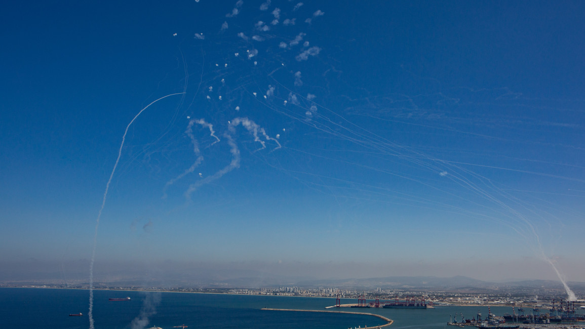 The Israeli military fires Iron Dome missiles to intercept dozens of rockets launched from Lebanon at the northern port city of Haifa, in Israel, on October 8, 2024. (Photo by Mati Milstein/NurPhoto via Getty Images)