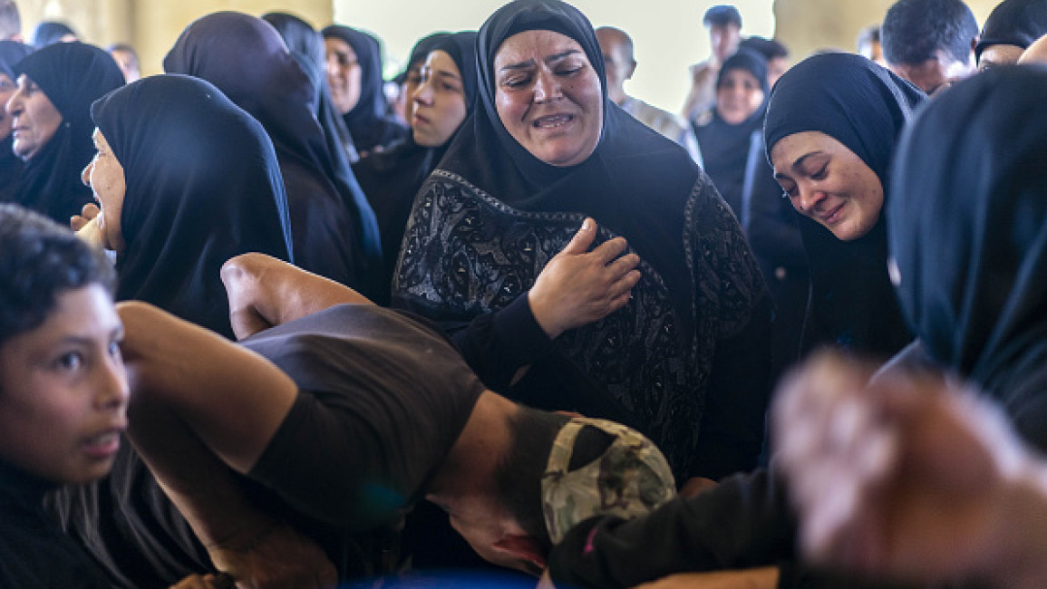  People mourn as they attend for the funeral ceremony of civilians lost their lives on Israeli airstrike on the town of Khodor, located in Lebanon's Bekaa Valley on October 09, 2024. 