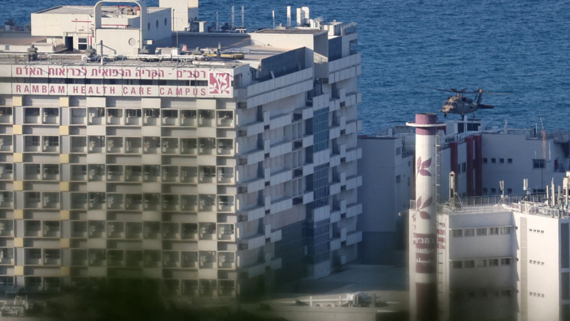 An Israeli military helicopter approaches Haifa's Rambam hospital before landing there