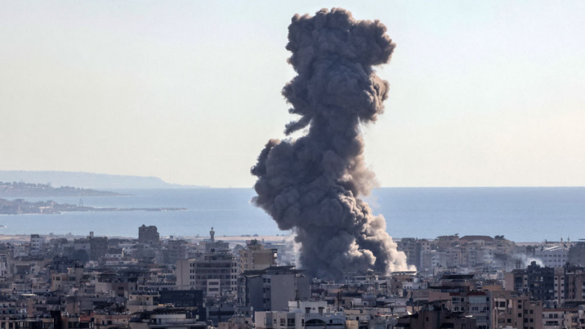 Thick smoke billows over buildings following an Israeli airstrike on Beirut's southern suburbs on October 19 [Photo by ANWAR AMRO/AFP via Getty Images]